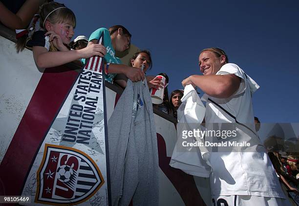 Abby Wambach of the USA signs fans autographs after the Women's International Friendly Soccer Match between Mexico and the United States at Torero...