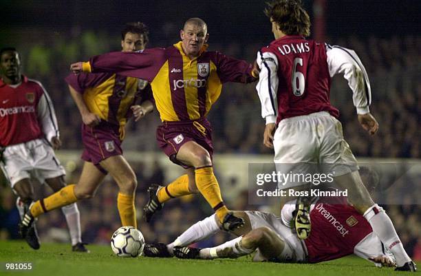 Dean Windass of Bradford City is tackled by Lee Dixon of Arsenal during the FA Carling Premiership match between Arsenal and Bradford City at...