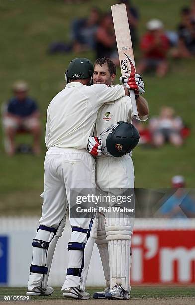 Simon Katich of Australia celebrates his century with Michael Hussey during day three of the Second Test Match between New Zealand and Australia at...