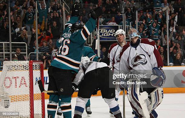 Scott Hannan and Craig Anderson of the Colorado Avalanche react to a goal by Devin Setoguchi of the San Jose Sharks during an NHL game on March 28,...