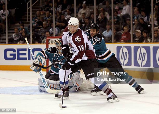 Thomas Greiss and Niclas Wallin of the San Jose Sharks defend against TJ Galiardi of the Colorado Avalanche at HP Pavilion on March 28, 2010 in San...