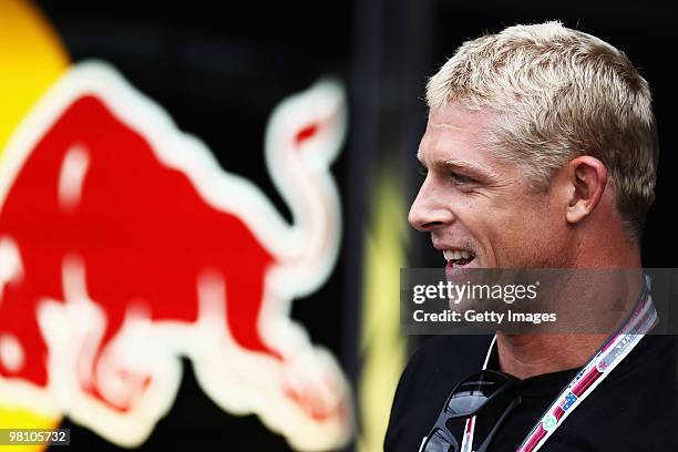 Australian professional surfer Mick Fanning is seen in the Red Bull Racing garage during the Australian Formula One Grand Prix at the Albert Park...