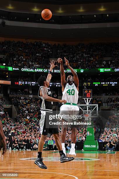 Michael Finley of the Boston Celtics takes a shot against Roger Mason of the San Antonio Spurs on March 28, 2010 at the TD Garden in Boston,...