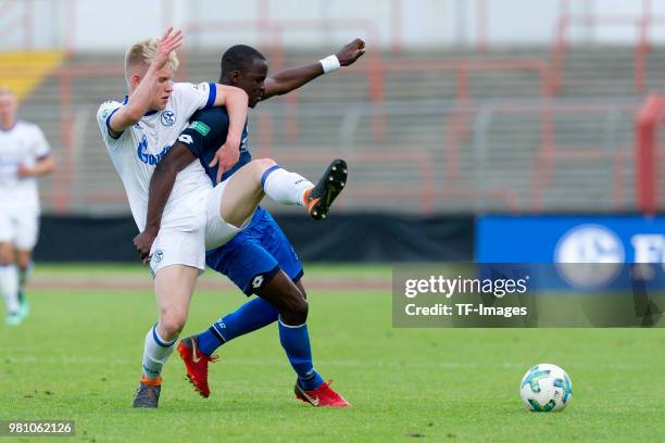 Lennart Czyborra of Schalke and Nya Chana of Hoffenheim battle for the ball during the U19 A-Juniors Bundesliga semifinal match between U19 FC...