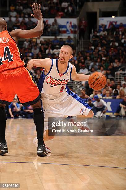 Steve Blake of the Los Angeles Clippers dribbles past Anthony Tolliver of the Golden State Warriors at Staples Center on March 28, 2010 in Los...