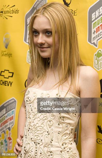 Dakota Fanning poses on the red carpet at the movie premiere of "The Runaways" during the 2010 SXSW Festival on March 18, 2010 in Austin, Texas.