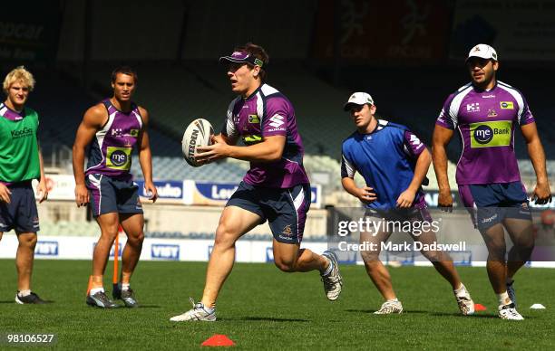 Rory Kostjasyn of the Storm evades a tackle during a Melbourne Storm NRL training session at Princes Park on March 29, 2010 in Melbourne, Australia.