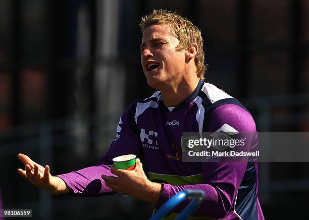 Brett Finch of the Storm shares a story with teammates during a Melbourne Storm NRL training session at Princes Park on March 29, 2010 in Melbourne,...