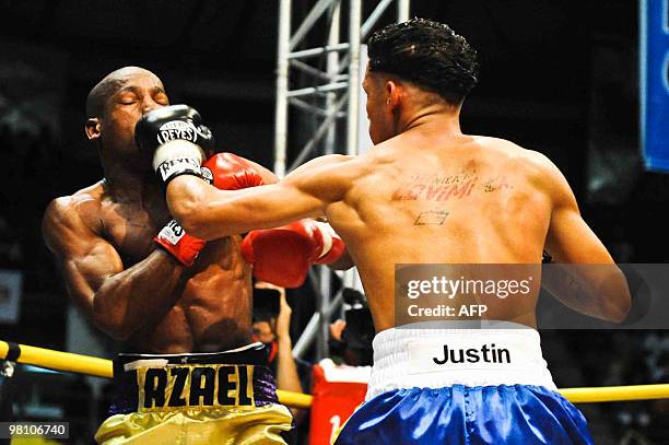 Johan Perez of Venezuela fights with Azael Cosio of Panama during their boxing match in La Guaira, Venezuela on March 27, 2010. Perez beat Cosio by...