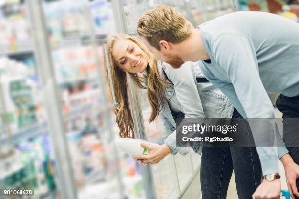 young couple - yogurt milk stock pictures, royalty-free photos & images