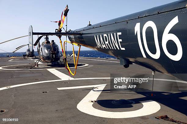 Picture taken on March 23 shows helicopters on the deck of French helicopter-carrier Jeanne d'Arc, en route from the French Caribbean island of La...