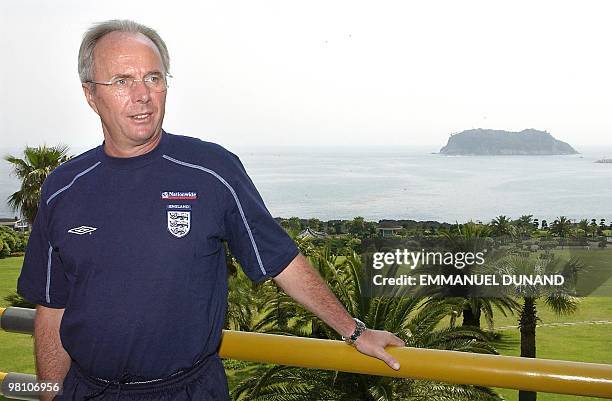 England national football team coach Sven-Goran Eriksson stands on a balcony overlooking Jeju island coast line 19 May 2002 at the end of a press...