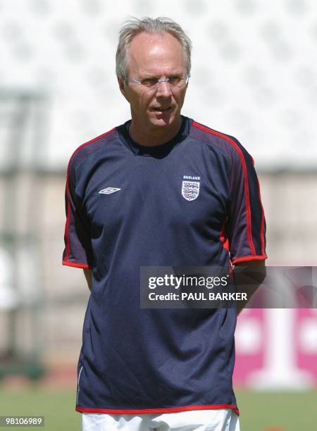 England coach Sven Goran Eriksson watches his team members during a training session 15 June 2004 near Lisbon in preparation for their next Euro 2004...