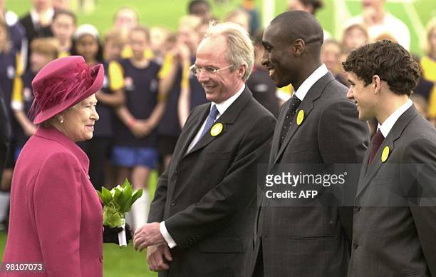 Britain's Queen Elizabeth II talks to Owen Hargreaves who plays for Bayern Munich, Sol Campbell of Arsenal FC and Sweden' Sven-Goran Eriksson, the...