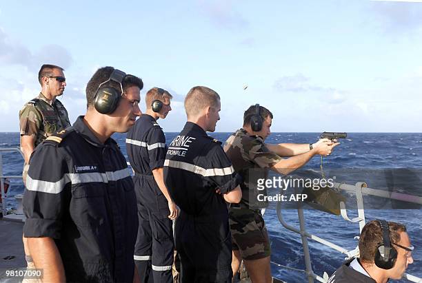 Picture taken on March 23 shows Marine soldiers during a shooting training session on board of French helicopter-carrier Jeanne d'Arc, en route from...