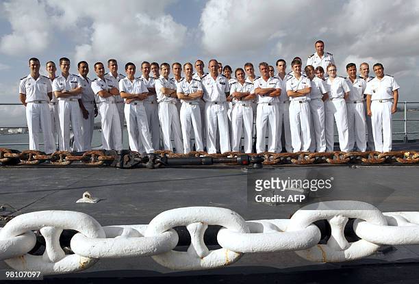 French junior officers pose on March 24 on board of French helicopter-carrier Jeanne d'Arc, during a call at San Juan in Puerto Rico. The Jeanne...