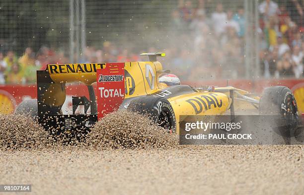 Renault driver Vitaly Petrov of Russia buries his car in the gravel after skidding off during Formula One's Australian Grand Prix in Melboune on...