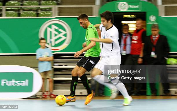 Players of VfV 06 Borussia Hildesheim and Futsal Club Portus Pforzheim battle for the ball during the DFB futsal cup at the Lausitz-Arena on March...