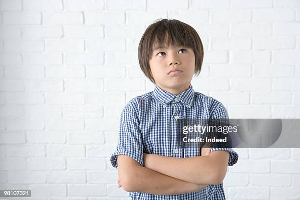 boy (8-9) considering - 8歳から9歳 ストックフォトと画像