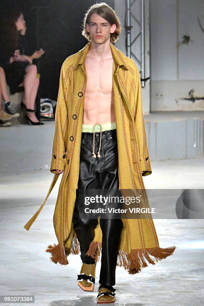 Model walks the runway during the Acne Studios Menswear Spring/Summer 2019 fashion show as part of Paris Fashion Week on June 20, 2018 in Paris,...