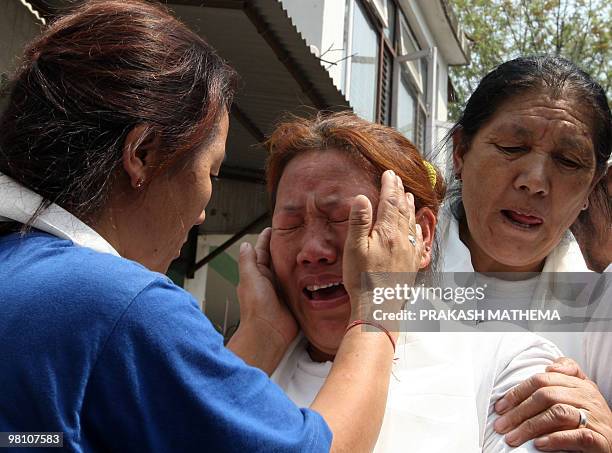 Tibetan in-exile breaks into tears after exiting the Kathmandu District Court following her release from a jail in Kathmandu on March 29, 2010. The...