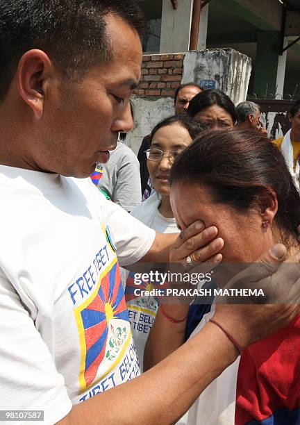 Tibetan in-exile breaks into tears after exiting the Kathmandu District Court following her release from a jail in Kathmandu on March 29, 2010. The...