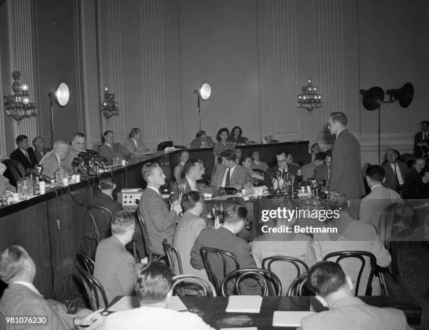 Charles Kramer, New Deal economist, alleged to have been a member of the communist spy ring in Washington, rises, right, to face his accuser,...