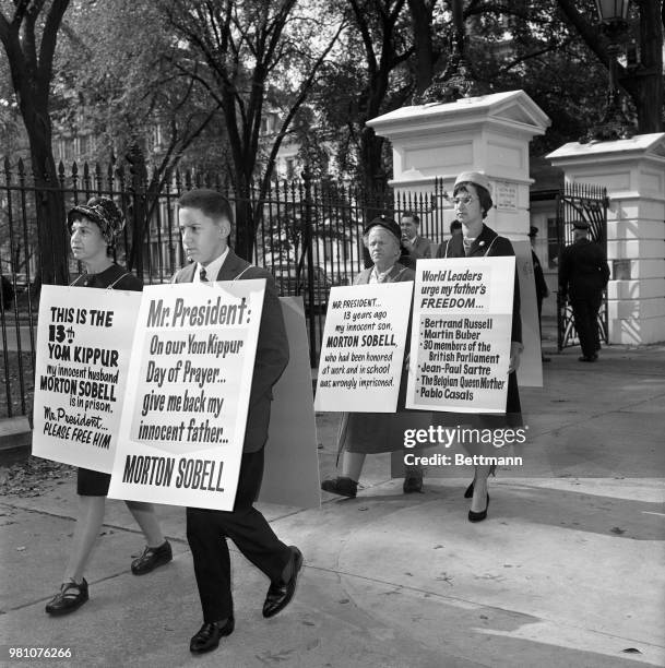 The family of convicted atomic spy, Morton Sobell, are shown as they picket the White House, the 13th Yom Kippur Sobell has spent in prison. Shown...