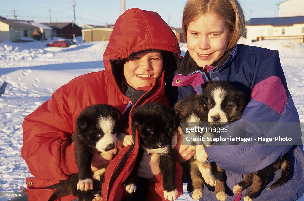 Children with puppies