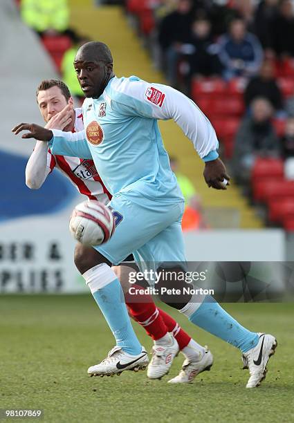 Adebayo Akinfenwa of Northampton Town looks for the ball with Paul Green of Lincoln City during the Coca Cola League Two Match between Lincoln City...