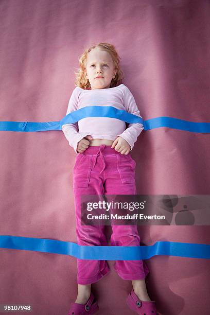 five year-old girl taped down to paper - down blouse stock pictures, royalty-free photos & images