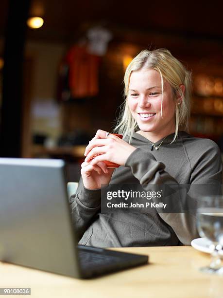 young woman with laptop - john p kelly stockfoto's en -beelden