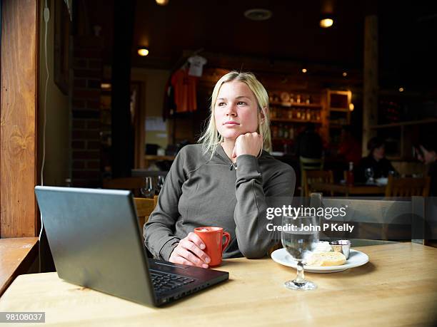 young woman with laptop - john p kelly stock pictures, royalty-free photos & images