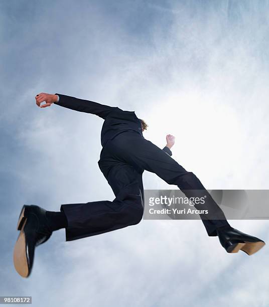 silhouette image of a business man running - man looking up imagens e fotografias de stock