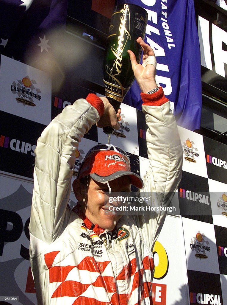 Clipsal Racing Jacket Jason Bright of the Holden Racing Team celebrates his victory after ...