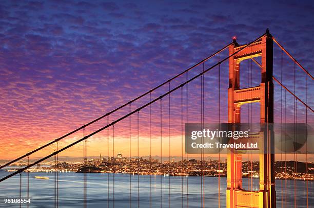 golden gate bridge and city skyline - travelpix stock pictures, royalty-free photos & images