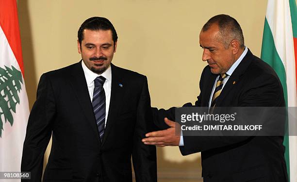 Bulgarian Prime Minister Boyko Borisov welcomes his Lebanese counterpart Saad Hariri prior to their meeting in Sofia on March 29, 2010. AFP PHOTO /...