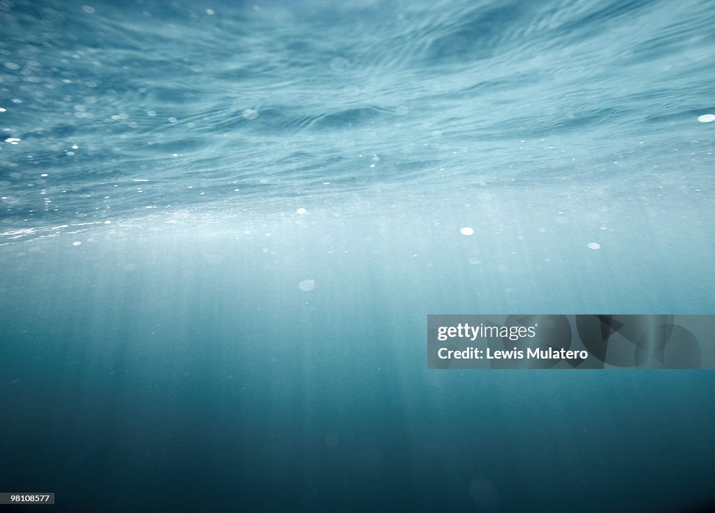 Ray of sunlight penetrating under ocean's surface