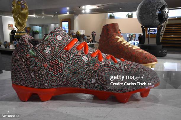 Football shoe is exhibited during the Huichol Art Biennial at Hotel Presidente Intercontinental on June 20, 2018 in Mexico City, Mexico. Artists...