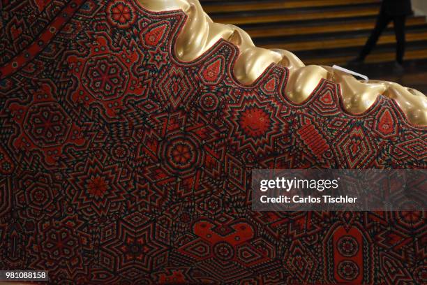 Football shoe is exhibited during the Huichol Art Biennial at Hotel Presidente Intercontinental on June 20, 2018 in Mexico City, Mexico. Artists...