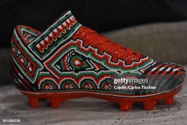 Football shoe is exhibited during the Huichol Art Biennial at Hotel Presidente Intercontinental on June 20, 2018 in Mexico City, Mexico. Artists...