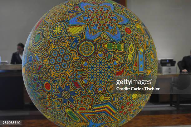 Football is displayed during the Huichol Art Biennial at Hotel Presidente Intercontinental on June 20, 2018 in Mexico City, Mexico. Artists capture...