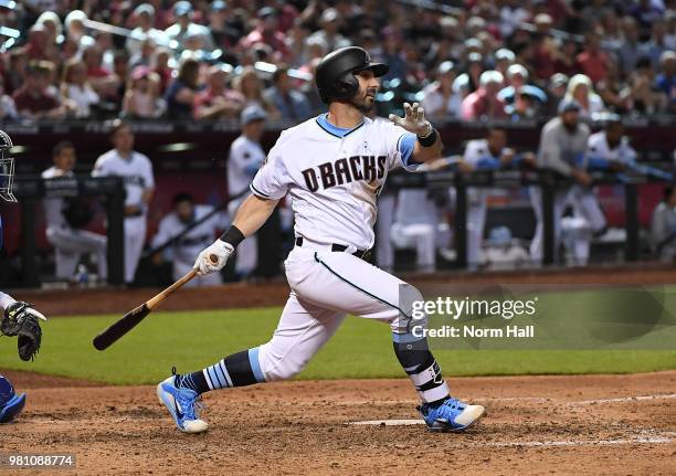 Daniel Descalso of the Arizona Diamondbacks follows through on a swing against the New York Mets at Chase Field on June 17, 2018 in Phoenix, Arizona.