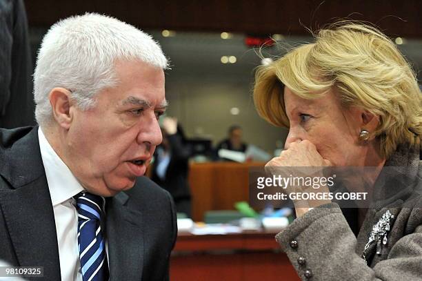 Spanish Finance Minister Elena Salgado and Portuguese Finance Minister Fernando Teixeira dos Santos chat on March 16, 2010 during a break of an...