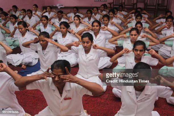 Civil hospital Nurses perform yoga on the occasion of World Yoga day, on June 21, 2018 in Mumbai, India. The first International Yoga Day was...