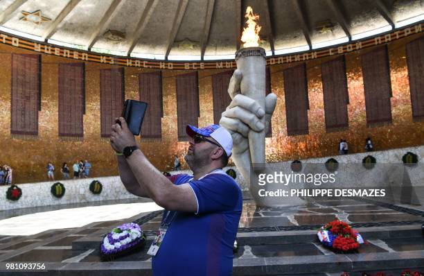 Supporter of Iceland's national football team takes a selfie picture in the "Hall of Military Glory" while visiting the Mamayev Kurgan World War Two...