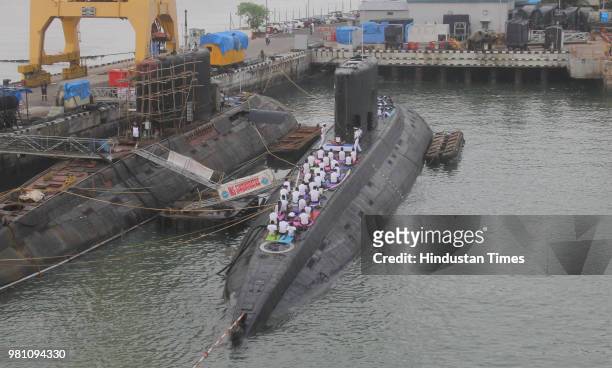 Indian Navy officials perform yoga on the Indian Navy's submarine INS 'Sindhuratna' on the occasion of World Yoga day, on June 21, 2018 in Mumbai,...