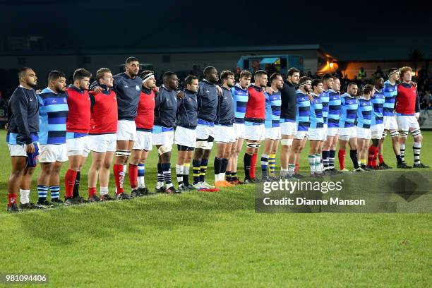 The Barbarians line up during a pre-game presentation of a metal claymore prior to the match between the Highlanders and the French Barbarians at...