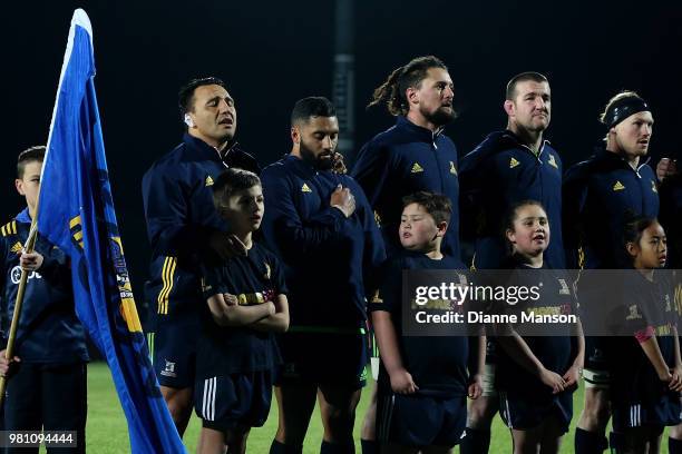 The Highlanders look on during the national anthems ahead of the match between the Highlanders and the French Barbarians at Rugby Park Stadium on...