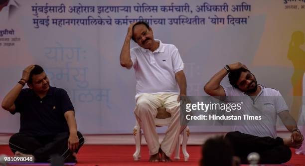 Vice-President Venkaiah Naidu with Maharashtra Chief Minister Devendra Fadnavis and Union minister Babul Supriyo as they perform yoga at Bandra...